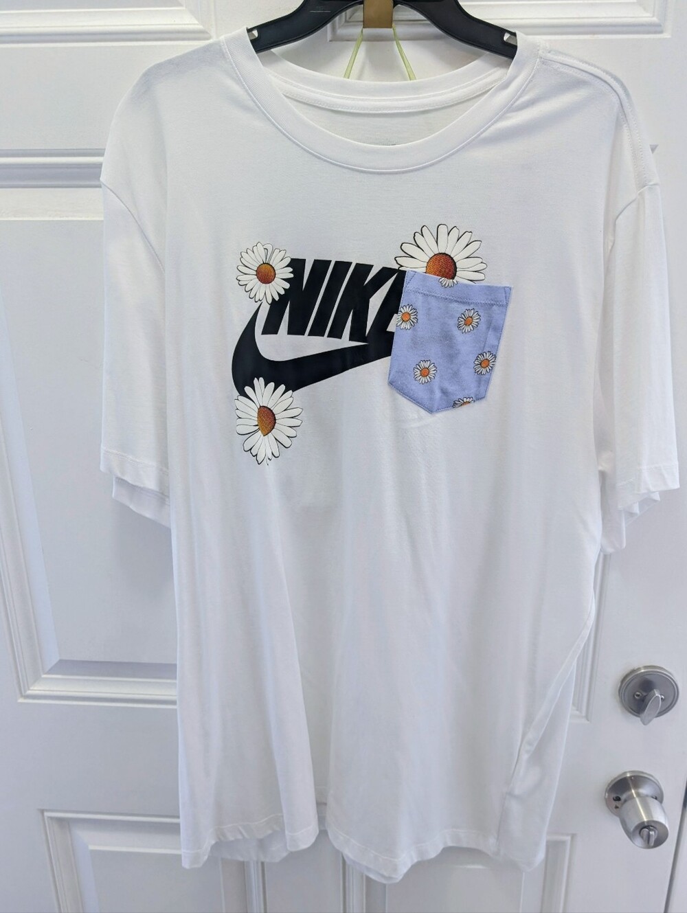 Nike White Tee with Black Logo and Blue Daisy Pocket